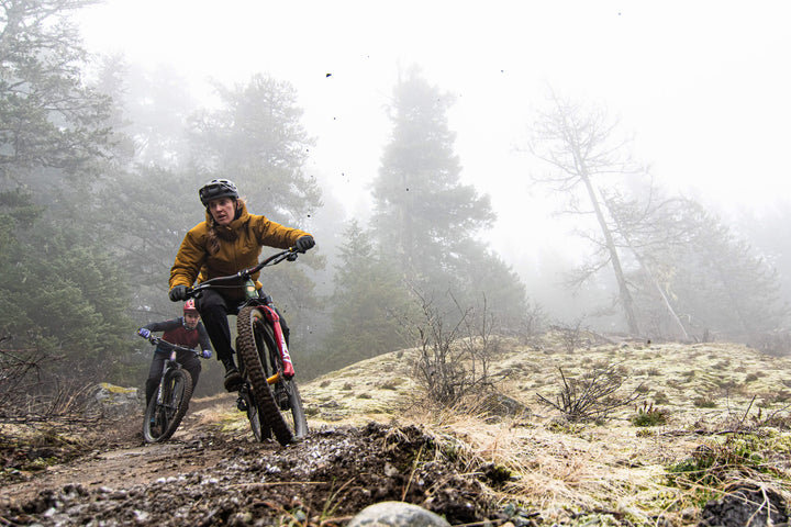 Female mountain bike rider in mystic mountains