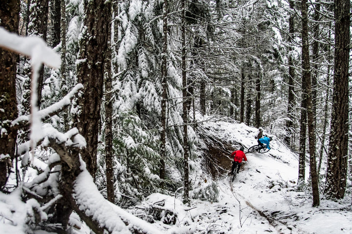 Winter mtb trail riding in snow covered forrest